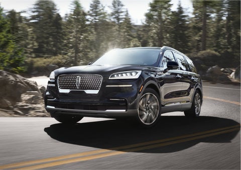 A Lincoln Aviator® SUV is being driven on a winding mountain road | Mathews Lincoln in Marion OH