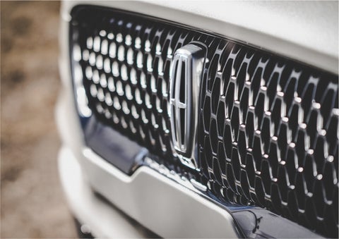 The grille of the 2023 Lincoln Aviator® Reserve model with an eye-catching repeated field of Lincoln Star logo shapes | Mathews Lincoln in Marion OH
