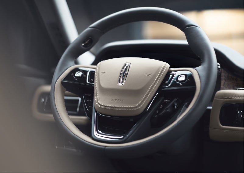 The intuitively placed controls of the steering wheel on a 2023 Lincoln Aviator® SUV | Mathews Lincoln in Marion OH