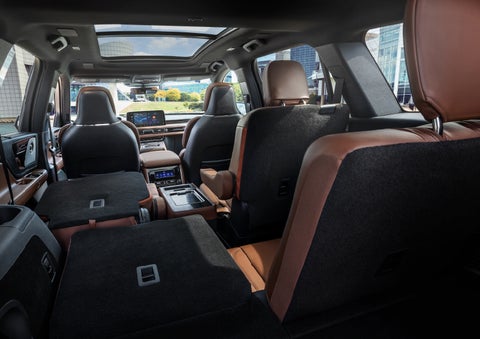 The interior of the 2025 Lincoln Aviator® SUV is shown with two seats folded down for added space. | Mathews Lincoln in Marion OH