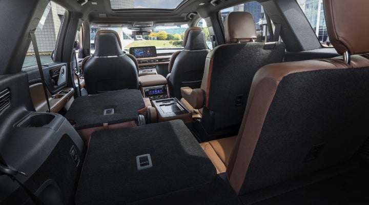 One side of the PowerFold® third-row seat and a second-row seat are folded forward in the 2026 Lincoln Aviator® SUV. | Mathews Lincoln in Marion OH