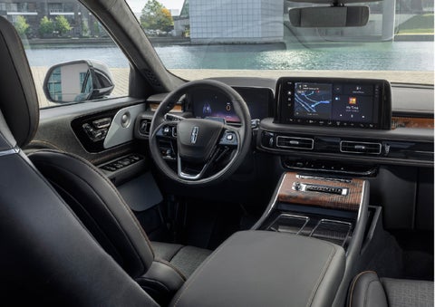 The interior of the 2026 Lincoln Aviator® SUV is shown parked with a view of a harbor through the windshield. | Mathews Lincoln in Marion OH
