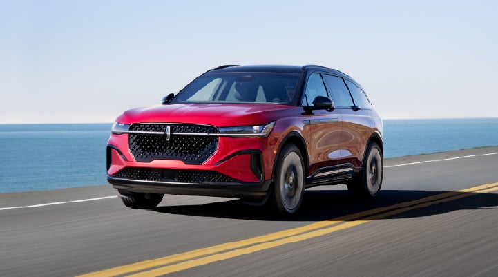 A 2026 Lincoln Nautilus® SUV is being driven on a seaside roadway. | Mathews Lincoln in Marion OH