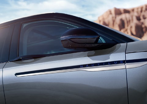 Blue lettering on the side of the vehicle that reads Nautilus indicates the available Hybrid Powertrain. | Mathews Lincoln in Marion OH